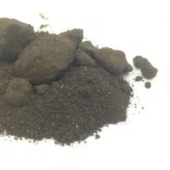 A batch of dry charcoal looking wild dagga extract powder and blocks
